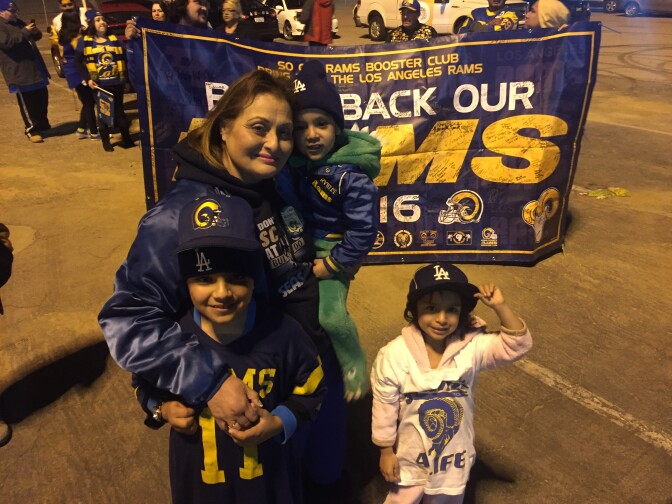 Deborah Retolaza of Covina celebrate the Rams' return with her grandchildren Maxim, Dean, and Jade.