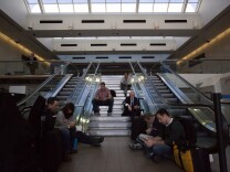 Passengers wait for their flights after a shooting at LAX on November 1st, 2013.