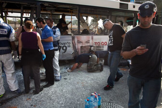 Emergency services respond to the scene of an explosion on a bus with passengers onboard on November 21, 2012 in central Tel Aviv, Israel. At least ten people have been injured in a blast on a bus near military headquarters in what is being described as terrorist attack, which threatens to derail ongoing cease-fire negotiations between Israeli and Palestinian authorities. 