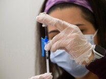 A syringe is filled with a dose of the Johnson & Johnson Covid-19 vaccine at a vaccination site at Baldwin Hills Crenshaw Plaza on March 11.