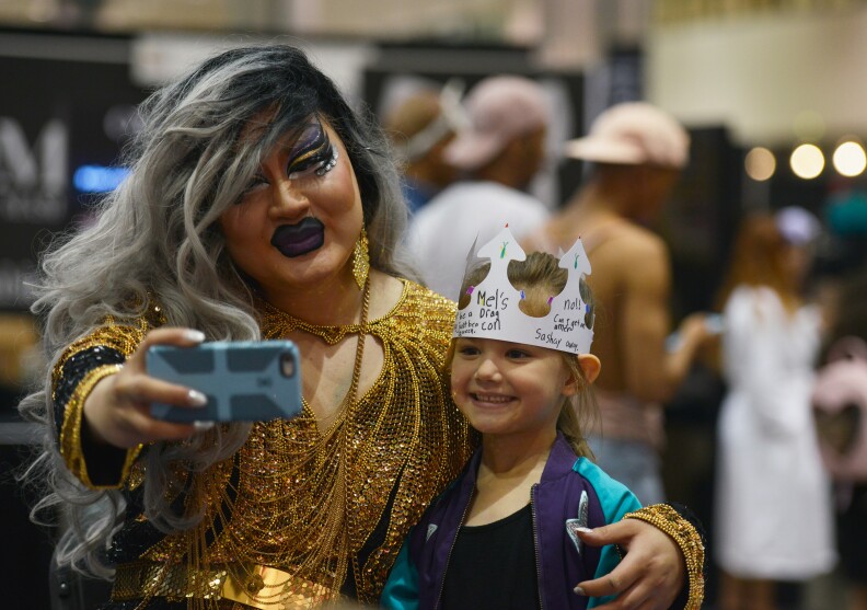 Attendees take pictures during RuPaul's DragCon at the Los Angeles Convention Center on April 30, 2017.