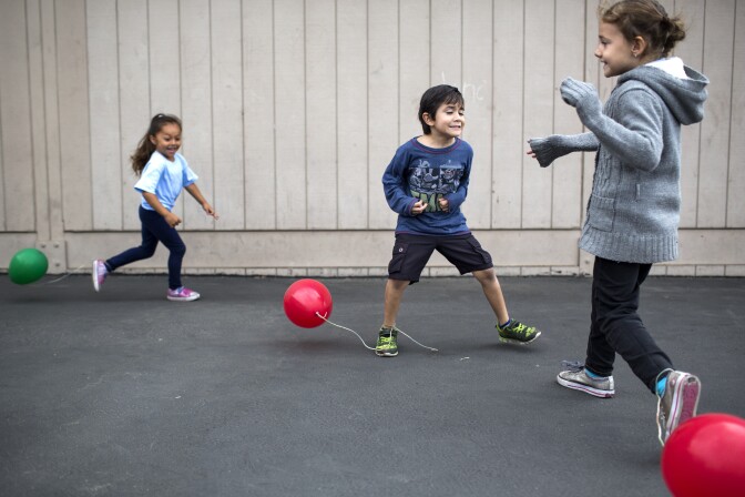 Transitional kindergarten student Anthony Arteaga takes part in a game called "balloon stomp" at the Richman School in the Fullerton School District on Tuesday morning, May 24, 2016. Currently there are 29 students enrolled in the morning transitional kindergarten group at the school.