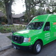  A smoke remediation van is parked on a residential street in Pasadena, a few blocks away from where homes burned down in the Eaton Fire. 