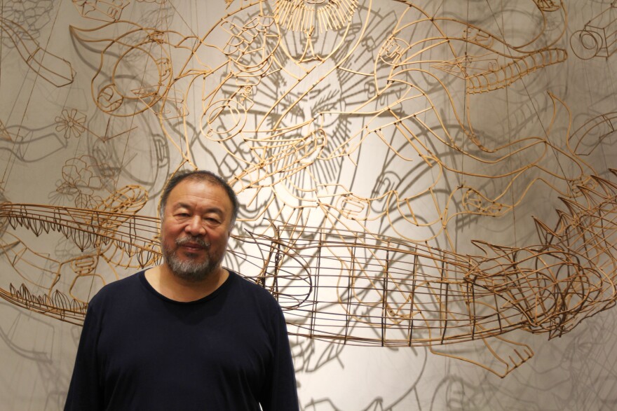 Chinese artist Ai Weiwei stands before a bamboo self-portrait at the Marciano Art Foundation in Los Angeles. "Ai Weiwei: Life Cycle" is open September 28, 2018–March 3, 2019. 