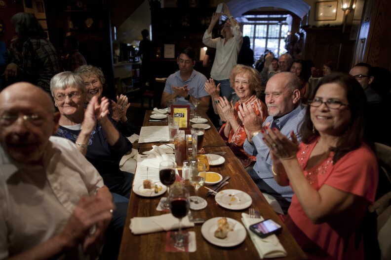Harry Hill's neighbors and friends applaud his performance at The Whale & Ale in San Pedro during his 101 birthday celebration.