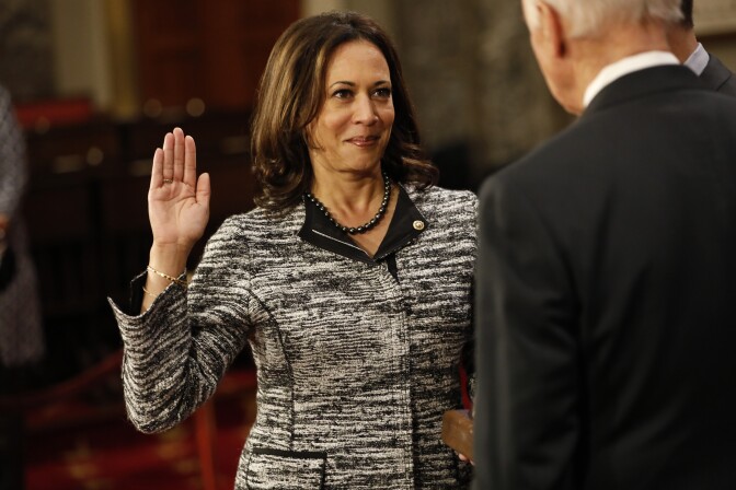 WASHINGTON, DC - JANUARY 3: U.S. Sen. Kamala Harris (D-CA) participates in a reenacted swearing-in with U.S. Vice President Joe Biden in the Old Senate Chamber at the U.S. Capitol January 3, 2017 in Washington, DC. Earlier in the day Biden swore in the newly elected and returning members on the Senate floor. (Photo by Aaron P. Bernstein/Getty Images)