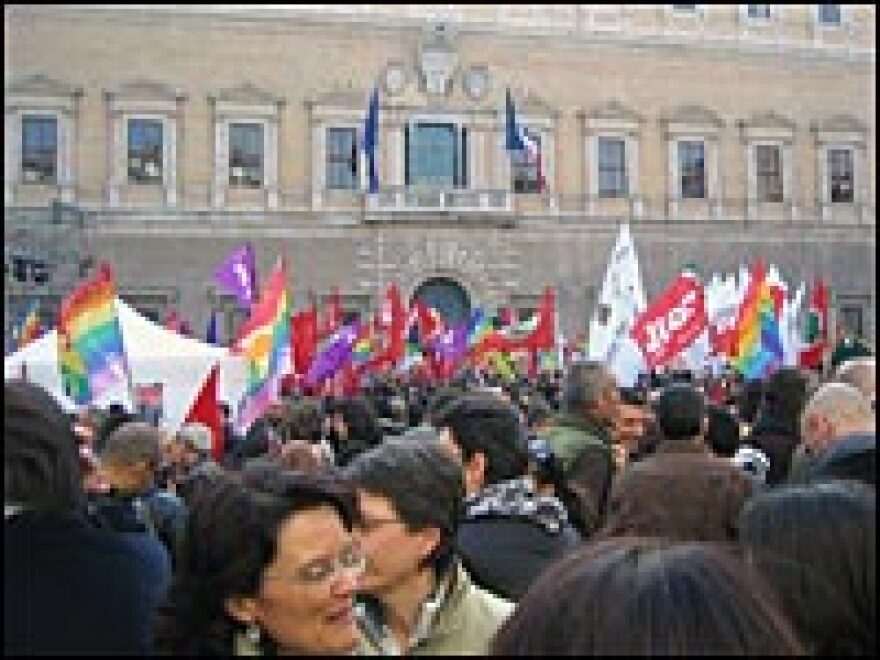 Demonstrators wave rainbow flags and shout slogans against the Vatican outside Renaissance Palace on Saturday.