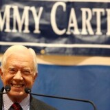 Former President Jimmy Carter smiles at the crowd at Emory University in Atlanta, Georgia.