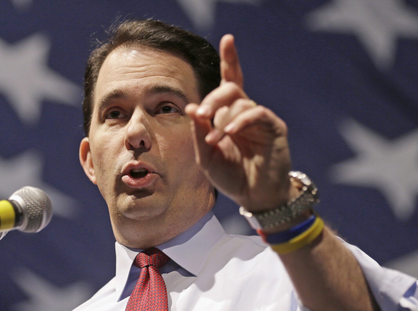 FILE - In this May 3, 2014, file photo, Wisconsin Republican Gov. Scott Walker speaks in Milwaukee. In a 5-2 ruling Thursday, July 31, 2014, the Wisconsin Supreme Court has upheld the 2011 law that effectively ended collective bargaining for most public workers, sparked massive protests and led to Walker's recall election and rise to national prominence. The ruling is a victory for Walker, who is considering a 2016 run for president and is seeking re-election this year. (AP Photo/Jeffrey Phelps, File)