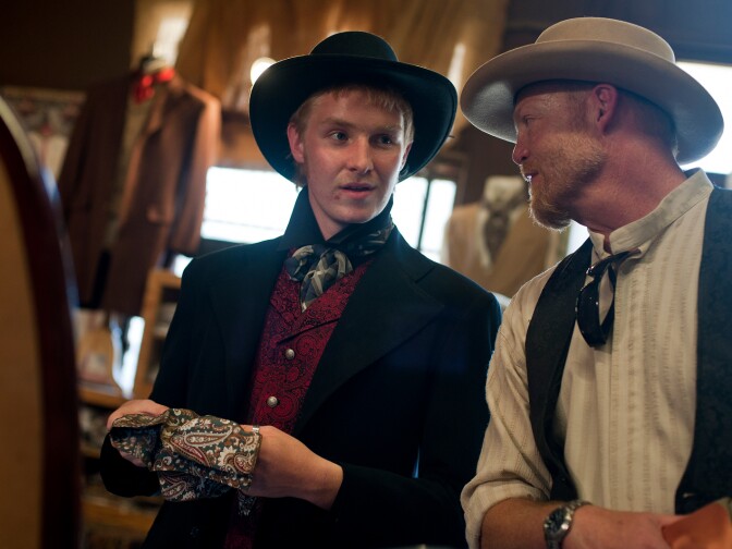 Quentin and father Jim Bechtol shop for Western-style clothing at LA-based Old Frontier Clothing Co. Bechtol said he's slowly building his cowboy clothing collection, and bought his jacket at the same store during last year's festival.