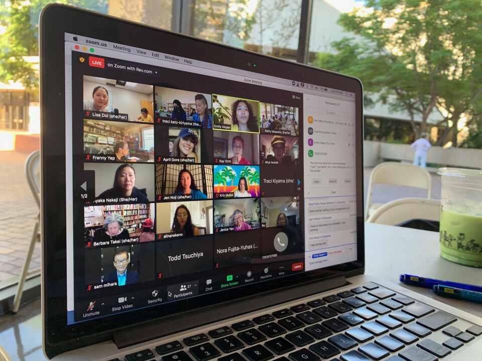 A picture of a laptop screen opened to a Zoom call. Japanese American activists appear in the different squares.