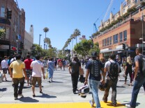 Pedestrians walk toward the Third Street Promenade in downtown Santa Monica.