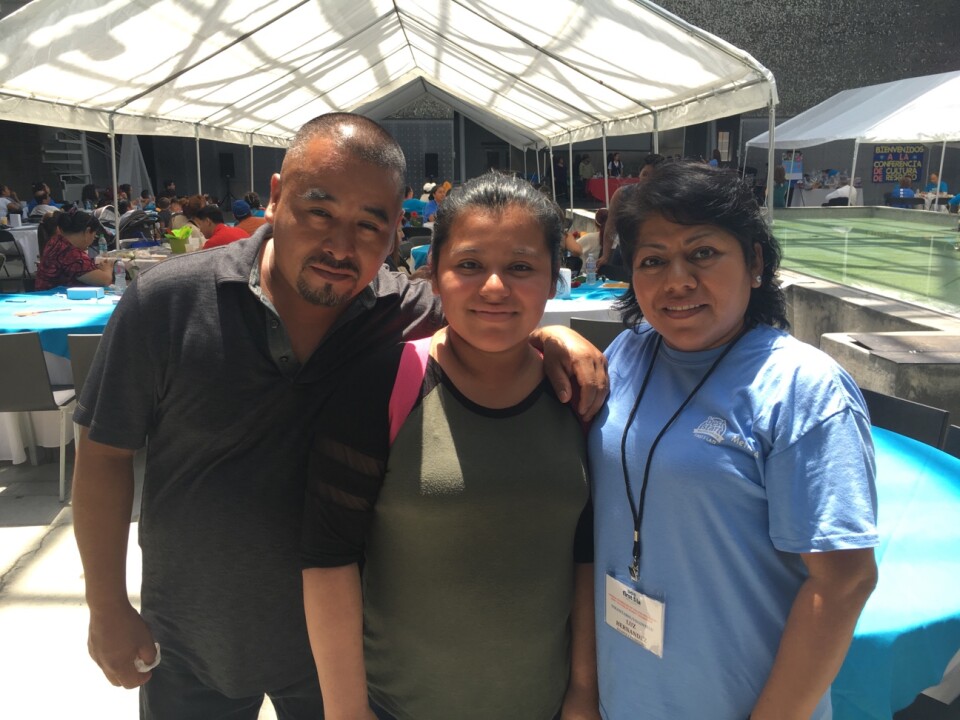 Kimberly Espinosa, 11, with her parents, Gil Espinoza and Luz Hernández, said youth like her need to take a part in ending violence in local neighborhoods.