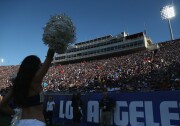 File: A cheerleader performs before the capacity crowd during the game between the Dallas Cowboys and the Los Angeles Rams at the L.A. Coliseum during preseason on Aug. 13, 2016. The Rams won 28-24.