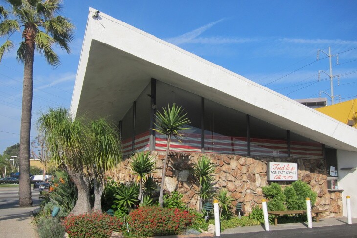 A roofline of a building juts up in a point