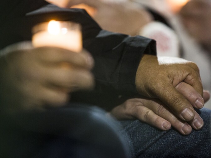 "Though we are a bankrupt city and now a terrorized city, we will not be beaten," San Bernardino City Attorney Gary Saenz said during a vigil at San Manuel Stadium in San Bernardino on Thursday night, Dec. 3, 2015 following a mass shooting that left 14 people dead and 21 injured on Wednesday at the Inland Regional Center.