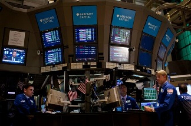 Traders work on the floor of the New York Stock Exchange.