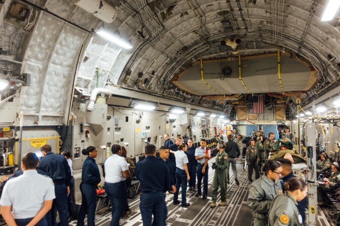 Air Force Junior Reserve Officer Training Corps cadets and Airmen participating in an aeromedical evacuation proficiency training mission aboard a Boeing C-17.