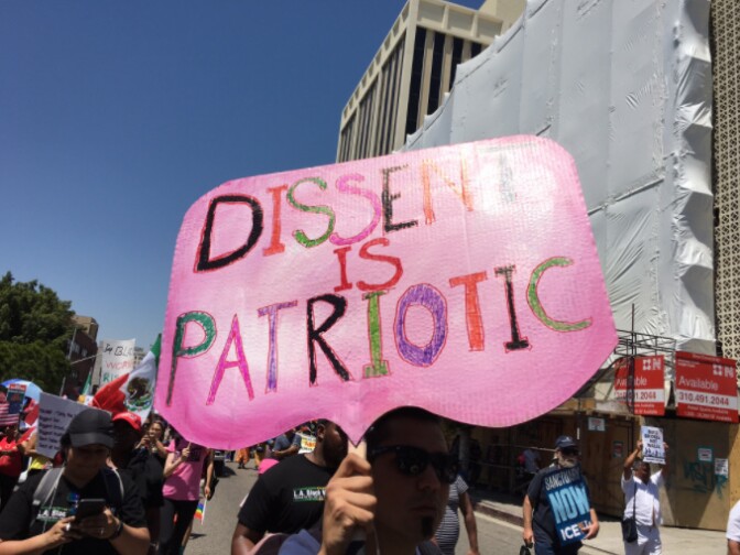 A marcher carries this sign during Monday's May Day rally in Los Angeles.