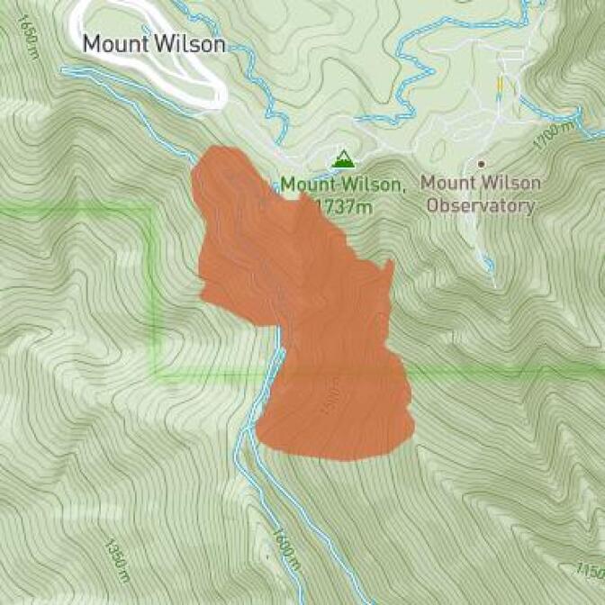 Harvey Milk poses in front of his camera shop in San Francisco in this Nov. 9, 1977 photo.