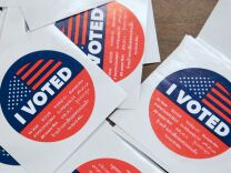 California's multi-language "I Voted" stickers on offer for early voters at the Los Angeles County Registrar's Office in Norwalk, California on November 5, 2018, a day ahead the November 6 midterm elections in the United States. (Photo by Frederic J. BROWN / AFP)        (Photo credit should read FREDERIC J. BROWN/AFP/Getty Images)