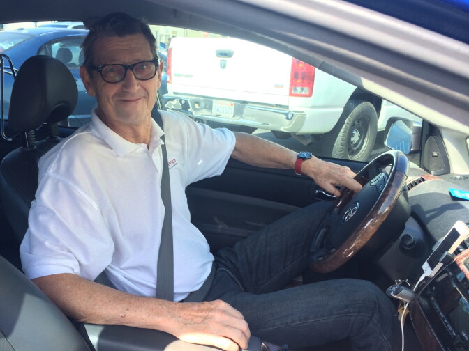 Lee Tomlinson at the wheel in his role as an Uber driver.