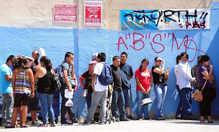This August 15, 2012 file photo shows young people waiting in line to enter the Coalition for Humane Immigrant Rights of Los Angeles (CHIRLA) office in California, on the first day of the Deferred Action for Childhood Arrivals (DACA) program. Democratic US President Barack Obama failed on his promise of immigration reform, and Republican challenger Mitt Romney has employed harsh rhetoric against illegal immigrants. Now both need the acquittal of Hispanics who feel disillusioned by one and threatened by the other.