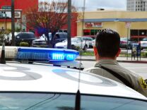 File: An officer from the Los Angeles County Sheriff's Department guards an intersection outside the Twin Towers Correctional Facility in L.A. on Feb. 8, 2013. 