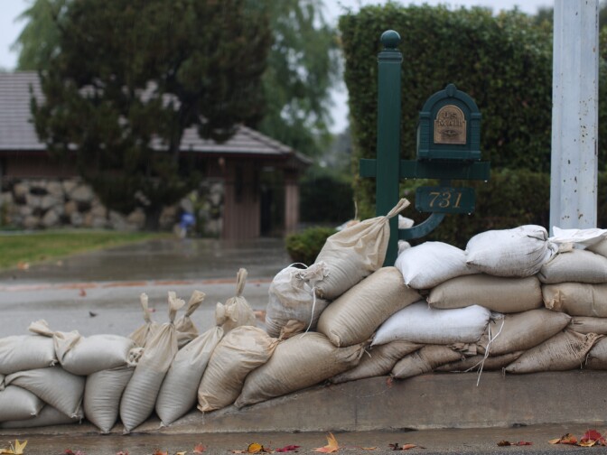 Sandbags and K rails line Rainbow Drive in Glendora on Tuesday, Dec. 2, 2014 in preparation for anticipated flooding. The street is near the burn area of January's Colby Fire.