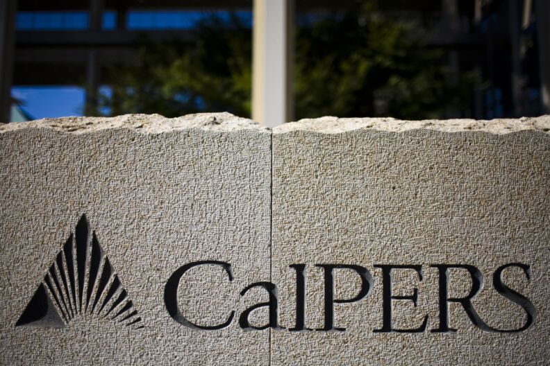 File photo:  A sign stands in front of California Public Employees' Retirement System building in Sacramento.