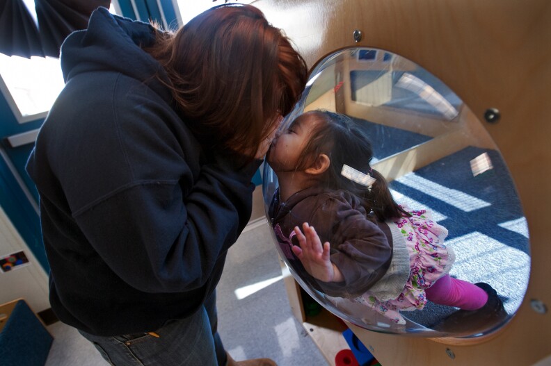 Michelle Zamora, 18, plays with her one-year-old daughter Melanie on Friday, Mar. 1. At age 15, Zamora became pregnant, and eventually had to drop out of high school.