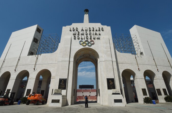 The Los Angeles Memorial Coliseum, venue for two previous Olympic Games, is seen in this on August 26, 2015 in Los Angeles, California. The Coliseum would be renovated and used as the main stadium if the city bids for the 2024 Summer Olympics. The Los Angeles city council is reviewing a $4.1 billion bid proposal for the 2024 Summer Olympics that backers say could produce a surplus of $161 million if the city is awarded a third Summer Games. A 218-page bid book made public on August 25 shows plans for a Los Angeles Games rely on private-sector partners to pay more than $1.7 billion in venue costs and includes revenue projections such as $4.8 billion from ticket sales, broadcast rights and corporate sponsorships.       AFP PHOTO / MARK RALSTON        (Photo credit should read MARK RALSTON/AFP/Getty Images)
