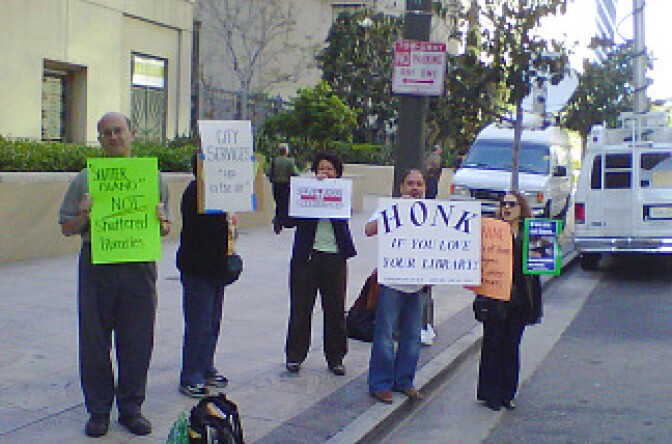 Protesters rally in front of the Central Library in downtown Los Angeles to protest cuts to library services. 