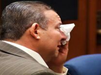 Former Bell city council member Luis Artiga cries as the verdict is read in the Bell city government corruption trial in March 2013. Artiga was found not guilty on all counts. Prosecutors are expected to announce Tuesday if they intend to retry five former Bell officials who were convicted of public corruption.