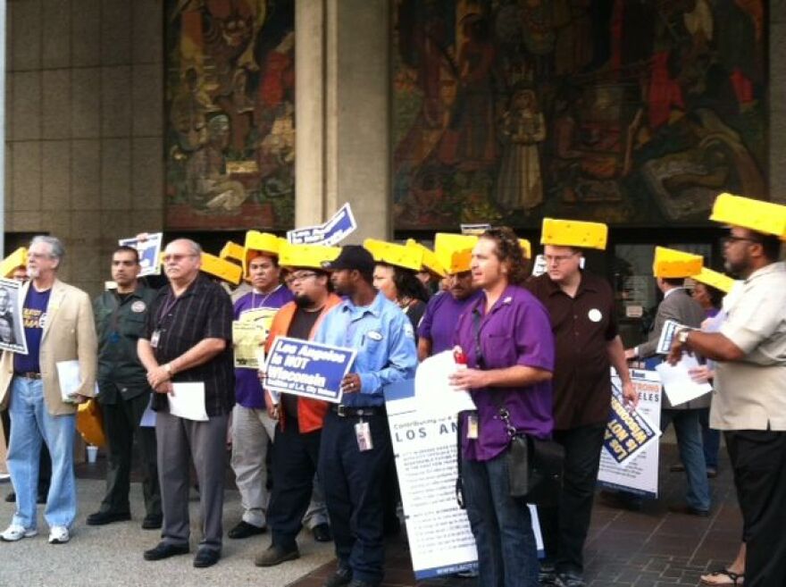 Workers with SEIU Local 721 rally against the city's proposed pension plan. Sept. 25, 2012. 