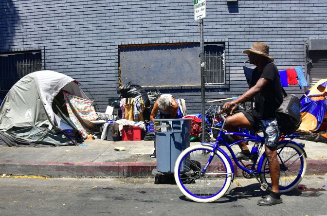 Tents and belongings of the homeless line a street in downtown Los Angeles, California on June 25, 2018, as a United Nations report on poverty and inequality says 185 million Americans are living in extreme poverty. - And in Los Angeles, which has one of the nation's largest homeless populations, the mayor said last week people may start getting arrested again for sleeping on the sidewalk now that the city feels it has enough new housing to meet settlement requirements. (Photo by Frederic J. BROWN / AFP)        (Photo credit should read FREDERIC J. BROWN/AFP/Getty Images)