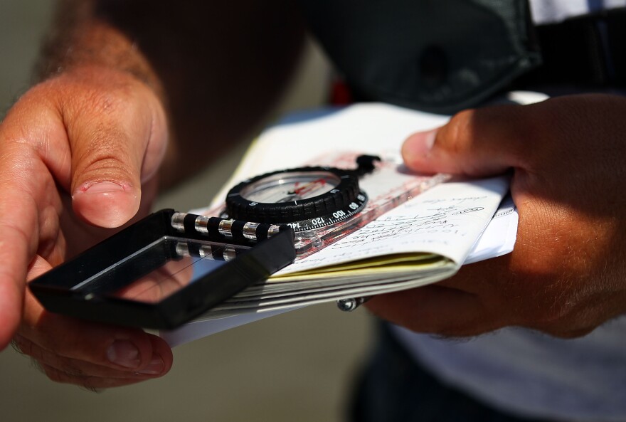 Environmental Protection Agency contractor Andy Kallus collects data while obtaining water samples for testing on May 31, 2010 near the point where the South Pass of the Mississippi River meets the Gulf of Mexico near Venice, Louisiana.