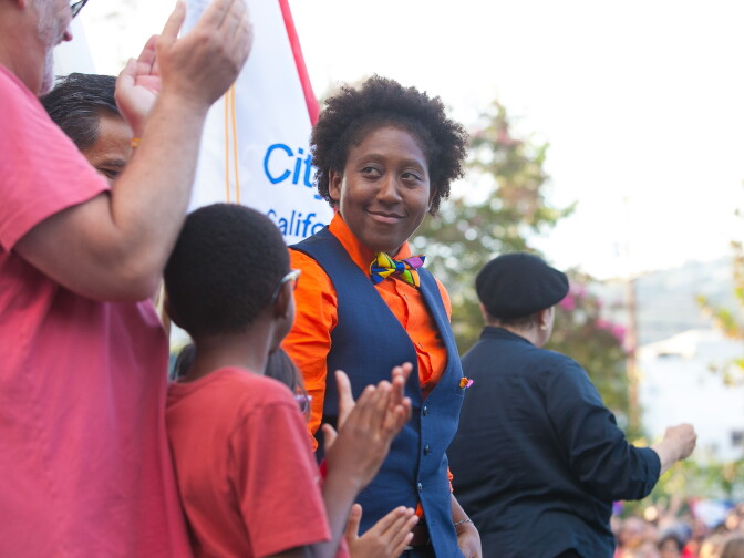 A family whose gay parents were plaintiffs in a court case involving same-sex marriage rights applaud a fellow speaker at the Decision Day Rally in West Hollywood Park to celebrate the U.S Supreme Court decision on marriage on Friday, June 26, 2015.