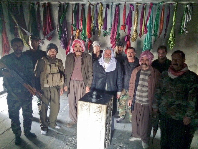 The stone pillar at the center of this temple is where Yazidi worshippers bring their prayers. "During the siege, we came here every day and asked God to save us," says a fighter named Shamwa Edo.
