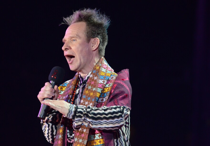 Movie director Peter Sellars speaks at the 19th Life Ball in front of the city hall in Vienna, Austria, on May 21, 2011. The Life Ball is a charity gala to raise money for people living with HIV and AIDS.AFP PHOTO/JOE KLAMAR (Photo credit should read JOE KLAMAR/AFP/Getty Images)