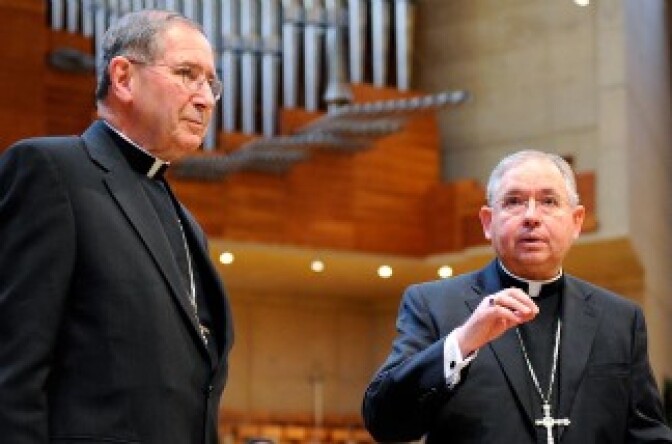 Cardinal Roger Mahony (L) listens as his successor, San Antonio, Texas Archbishop Jose Gomez, during a news conference at the Cathedral of Our Lady of the Angels on April 6, 2010 in Los Angeles, California. 