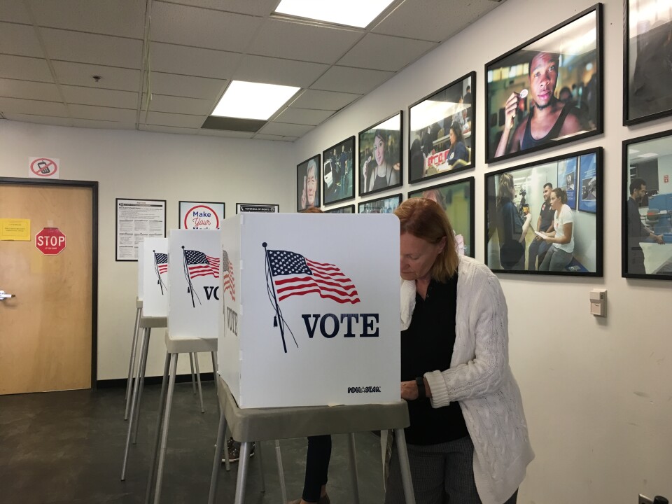 A registered voter casts a ballot in early voting at the Los Angeles County registrar's office in Norwalk on Oct 14, 2016.