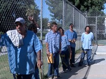 Prisoners at the California Institution for Men in Chino line up, waiting for medical appointments.