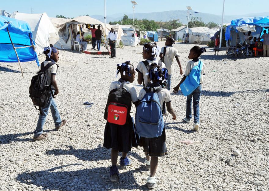 A view of a tent city is seen on January 8, 2013 in Marassa, a suburb of Port-au-Prince. Three years after the earthquake that devastated Haiti, 360,000 people are still living under tarps: among them, the inhabitants of the camps 'Marassa', located northeast of Port-au-Prince, who feel abandoned by everyone. About 750 families, or 5,000 people, coexist in these makeshift camps three 'Marassa' 9, 10 and 14, under the permanent threat of a large river that runs through the neighborhood.