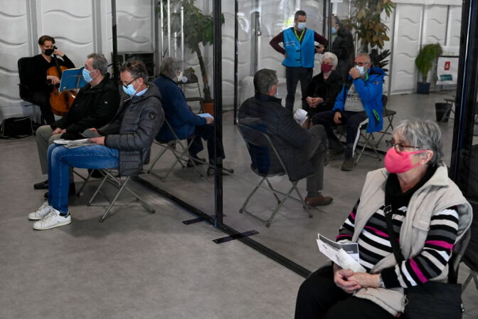 Illustration shows the live performance of cello-player Bunzendahl, at the VacCovid vaccination centre at Park Spoor Oost, in Antwerp, Tuesday 23 March 2021. Research has shown that classical music reduces stress, discomfort and anxiety in a waiting room. Because live music intensifies this effect, cellist Bunzendahl is performing at the vaccination village at Spoor Oost in Antwerp. This first live performance in VacCovid is a trial performance, which may be continued. BELGA PHOTO DIRK WAEM (Photo by DIRK WAEM/BELGA MAG/AFP via Getty Images)