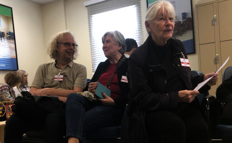 Arthur Kegerreis, Ecri Gutierrez and Edie Salisbury wait and prepare to visit immigrant detainees inside the women’s wing of the Adelanto Detention Center. 
