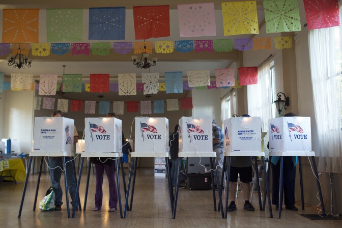 Los Angeles County residents vote inside All Saints Episcopal Church in Highland Park during election day on Tuesday afternoon, Nov. 4, 2014.