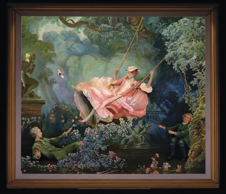 A woman in an 18th century pink dress on a swing with a man pushing her and another laying on the ground in front of her.