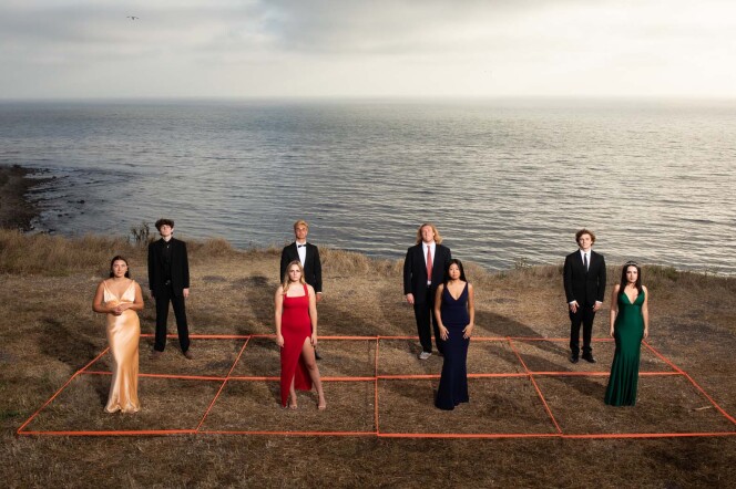 High school students dressed for prom pose on a socially-distant grid