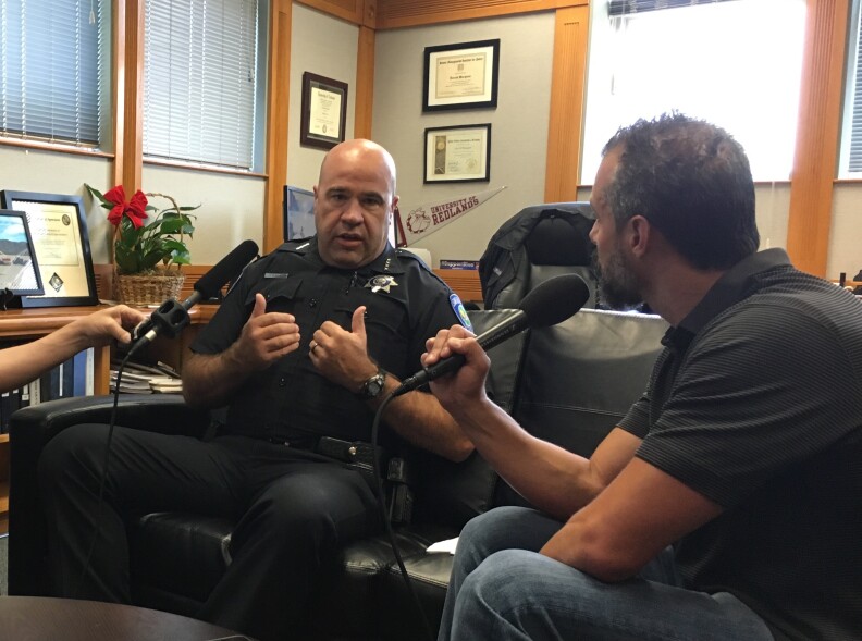 Chief Jarrod Burguan talks to A Martinez